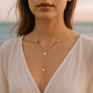 COLLAR COLECCIÓN KARI EN FORMA DE "Y" DE ESTRELLAS DORADO Y PLATEADO CON CRISTALES.